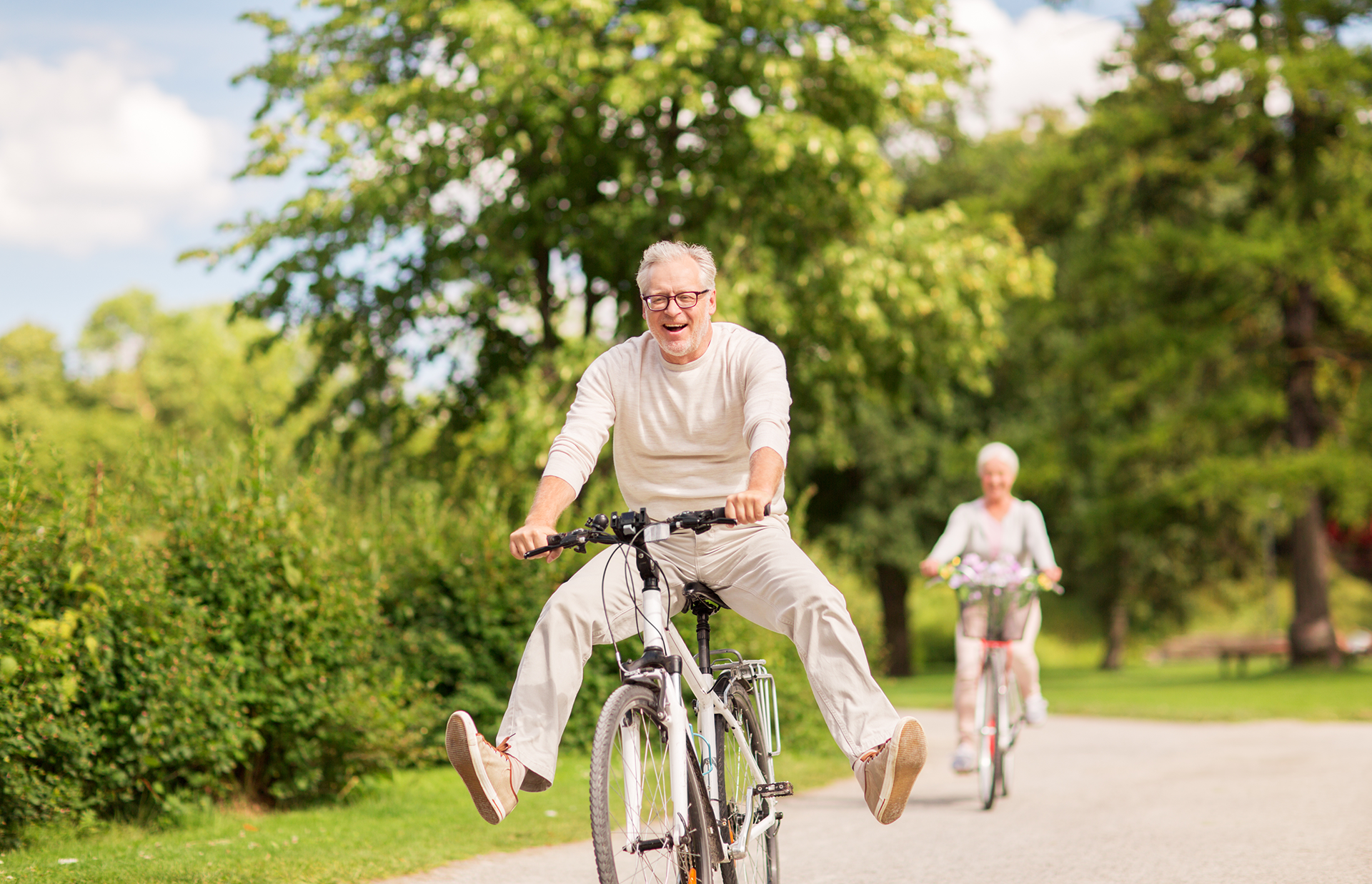 elderly couple riding bikes